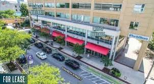 Storefronts with red awnings on a downtown Evanston street, Illinois