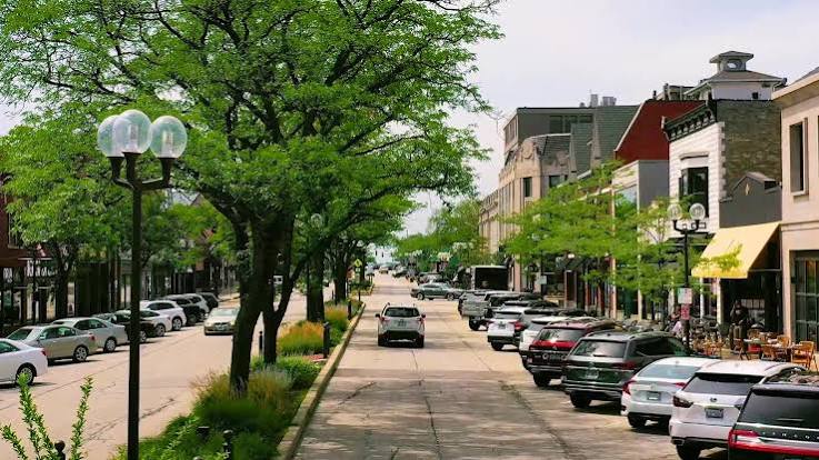 Tree-lined downtown street with globe lamps, Highland Park, Illinois